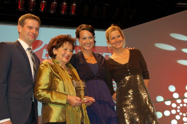 Challenge CEOs Alice and Kathrin Walchsh&#246;fer accepting the award from chief editor of Triathlon Magazine, Frank Wechsel.